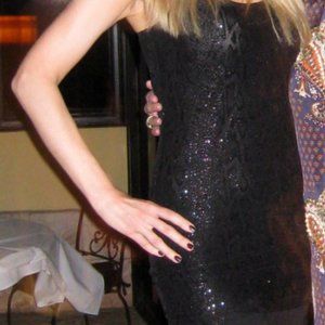 Fitted black mini dress with shimmer snake print, M